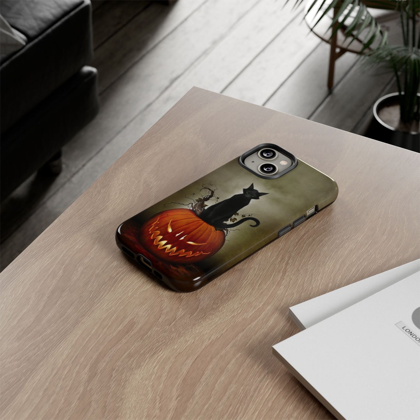 Cat O' Lantern tough phone case laying flat on table — Halloween dark art by Mister Sam Shearon
