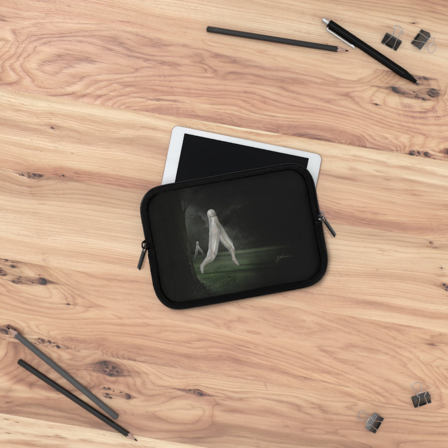 Nightcrawler laptop sleeve flat lay — Mister Sam Shearon cryptozoology dark art