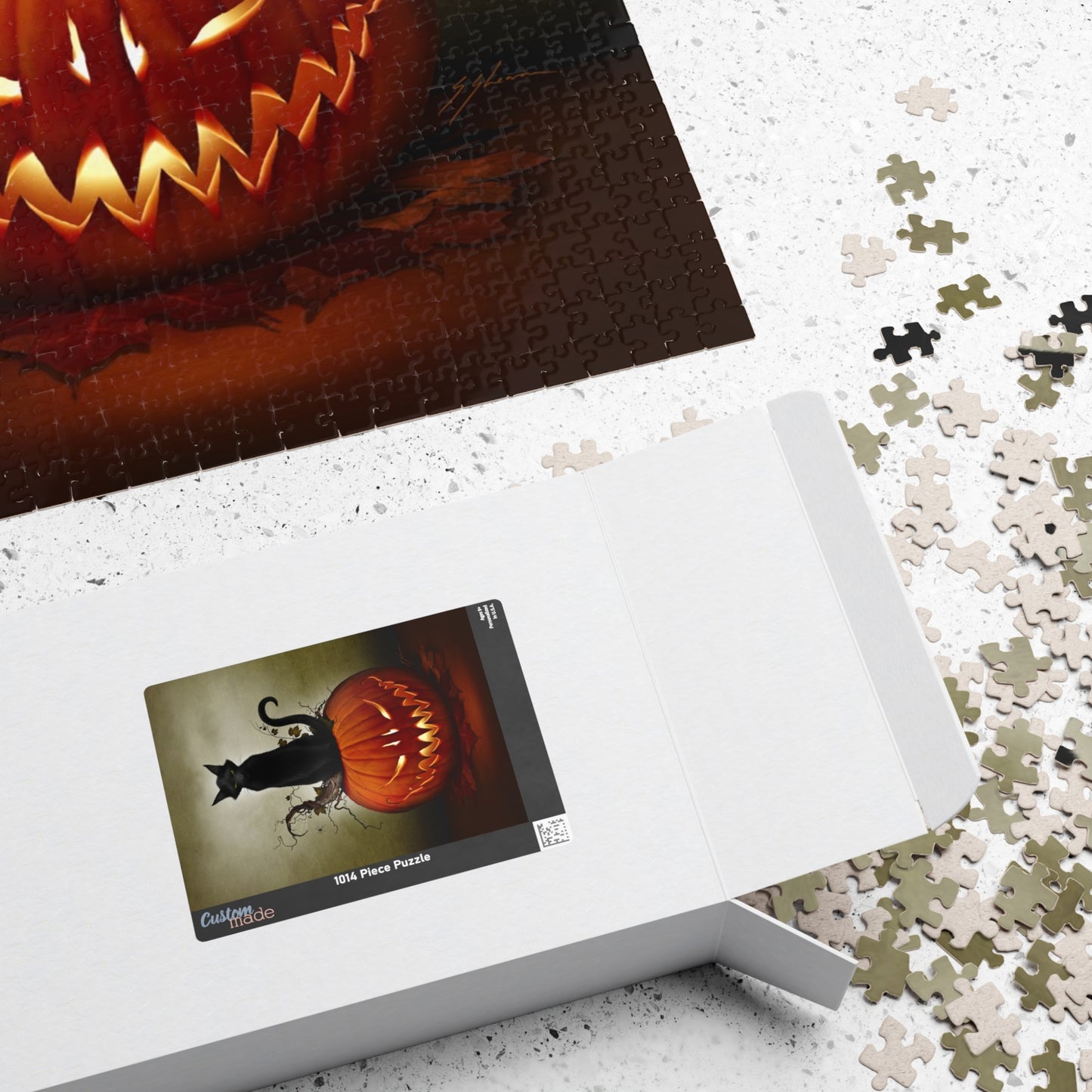 Cat O' Lantern puzzle detail shot — glossy laminated finish, original dark art