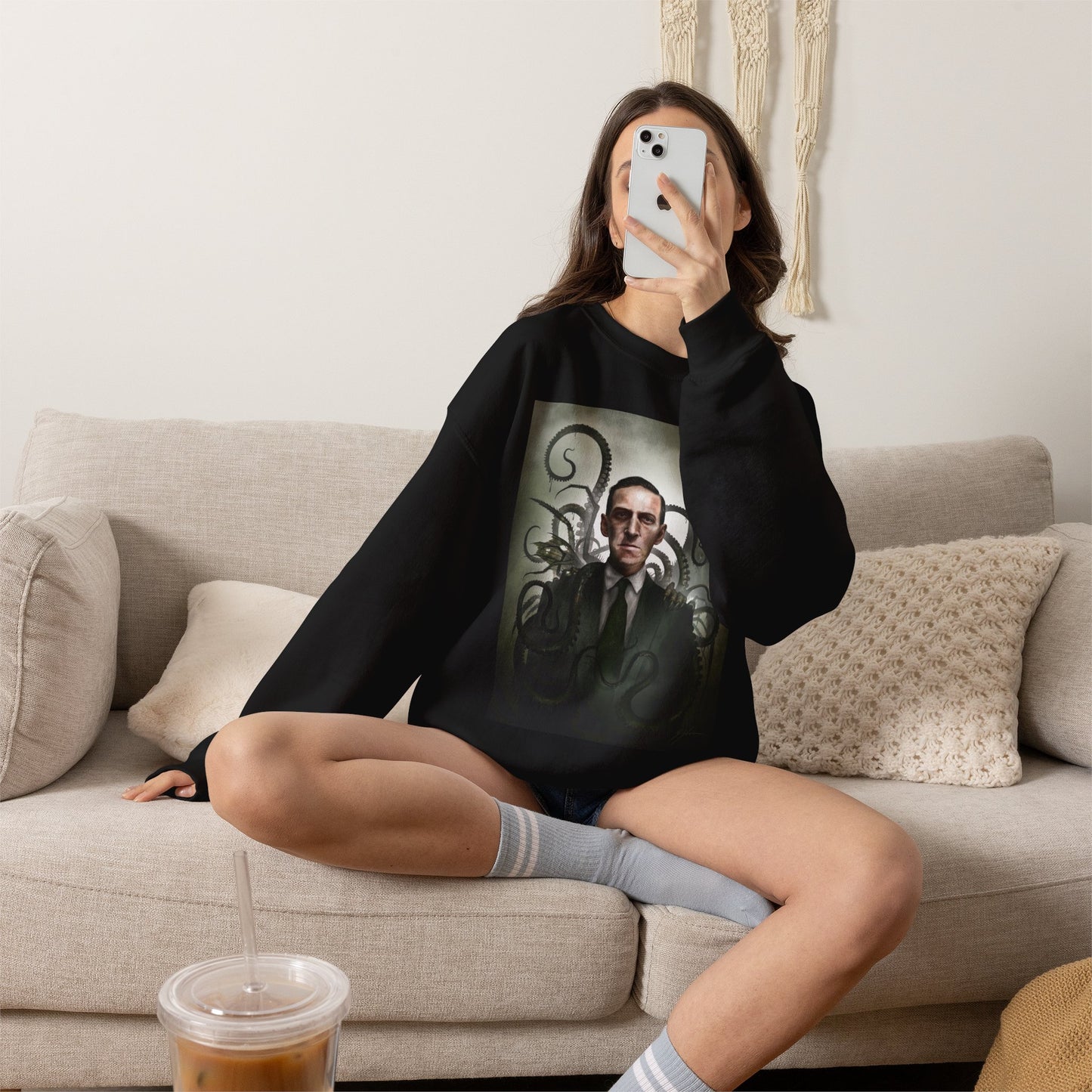 H.P. Lovecraft sweatshirt detail shot — close-up of dark art print on black crewneck