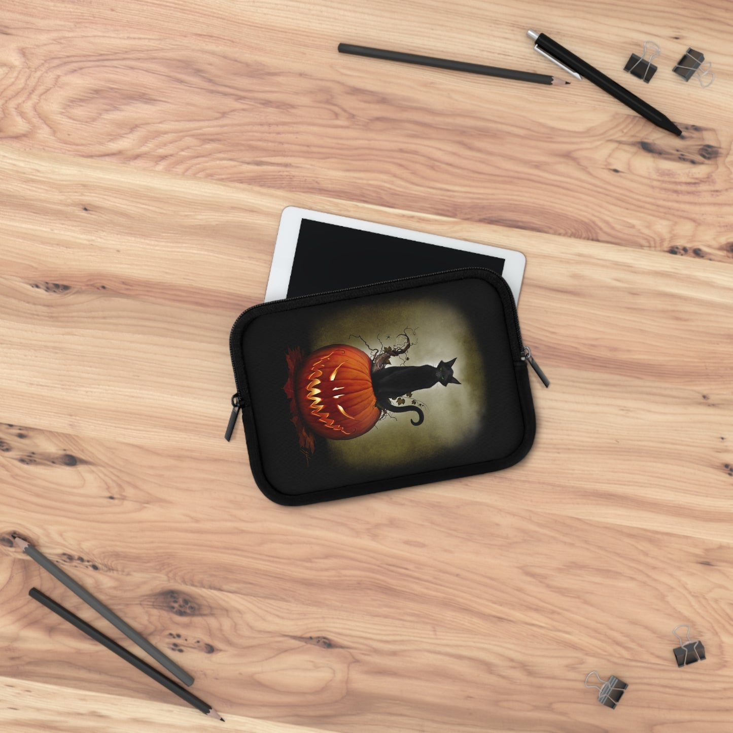 Cat O' Lantern laptop sleeve flat lay — Mister Sam Shearon All Hallows' Eve dark art