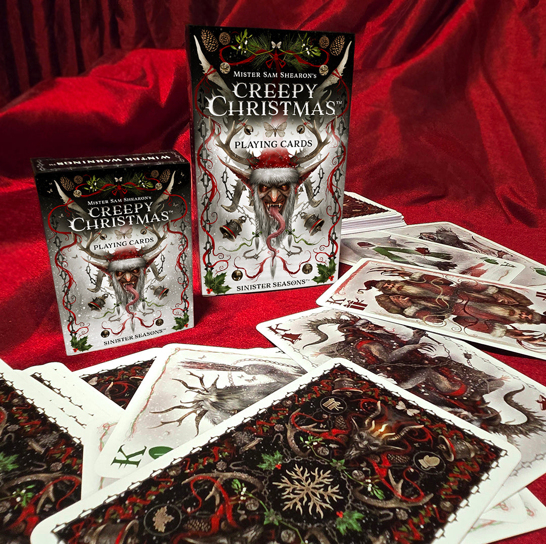 Regular and large Creepy Christmas card boxes with large cards spread out