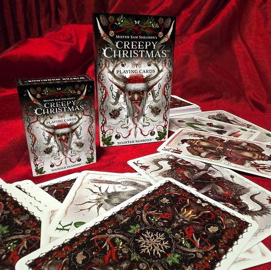 Regular and large Creepy Christmas card boxes with large cards spread out